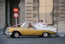Bride and Groom in Vintage 1950s Getaway Car